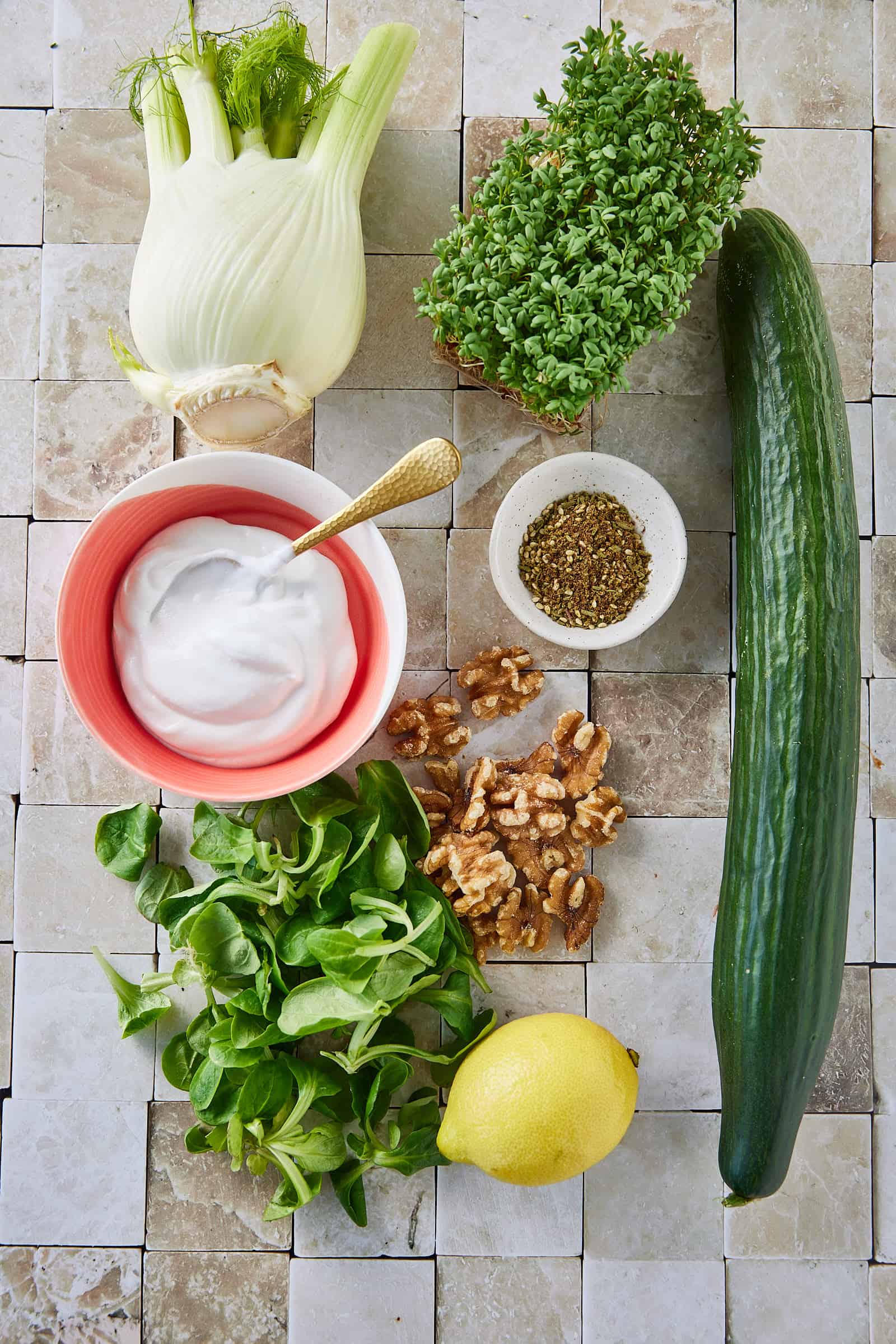 Ingredients for cucumber salad with walnuts and fennel
