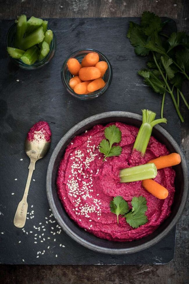 Beetroot hummus served with vegetable sticks