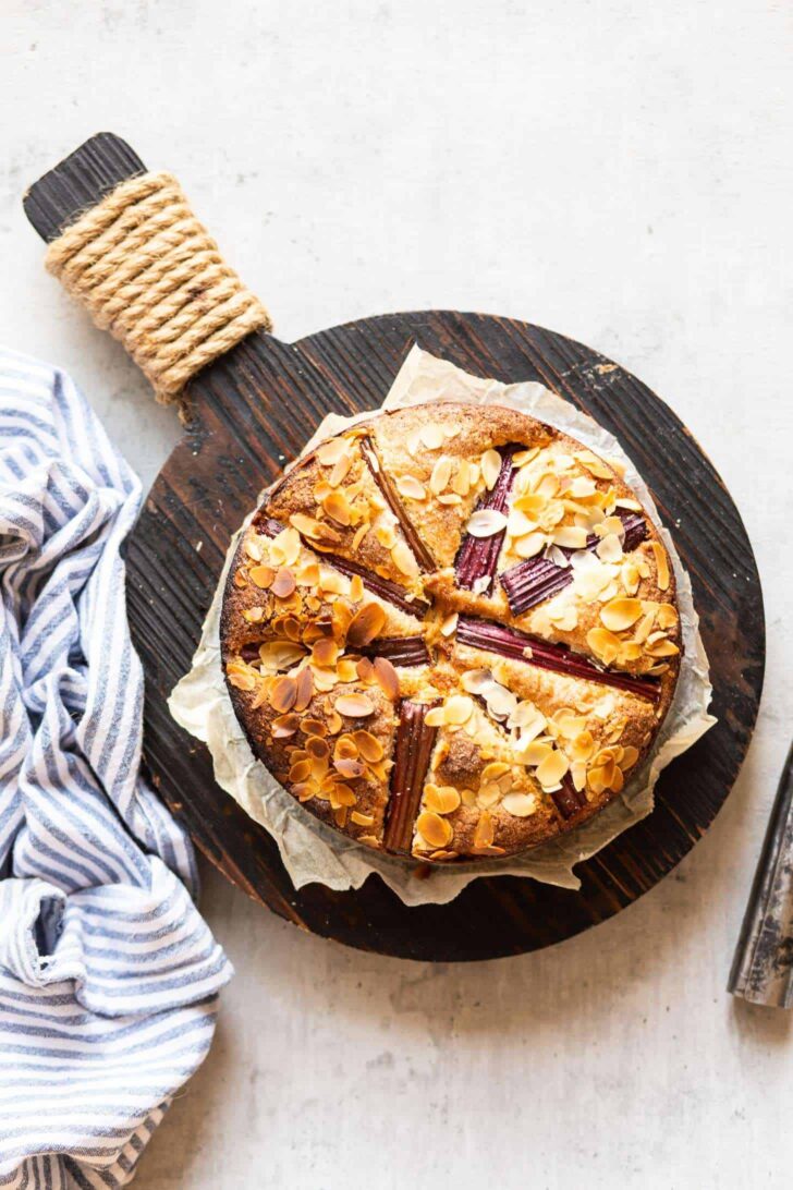 Delicious rhubarb cake on wooden plank