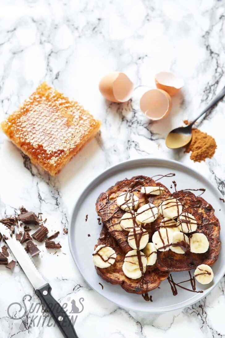 Raisin bread french toast with honey, banana and chocolate
