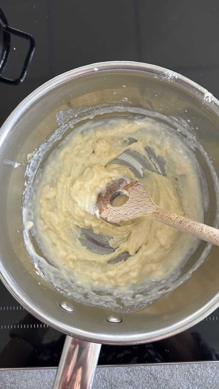 Add milk to the white roux