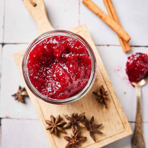Cranberry compote with star anise on a little wooden board