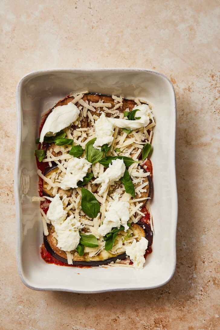 Add the mozzarella on top of the grated cheese and repeat all the layers.