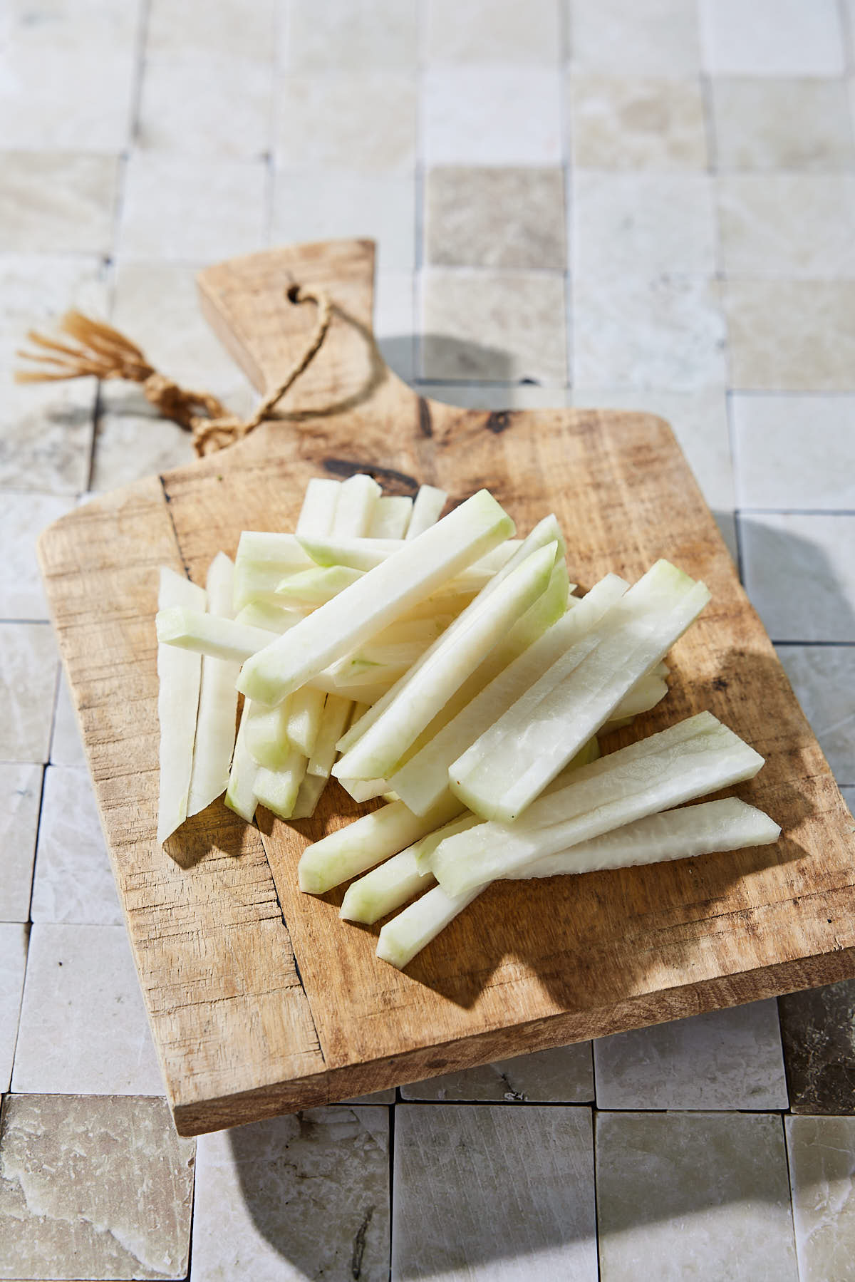 Slicing and cleaning the kohlrabi into sticks